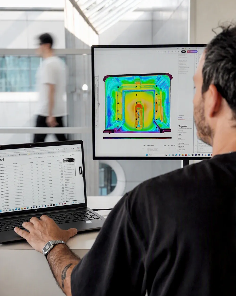 Engineer reviewing data on monitors
